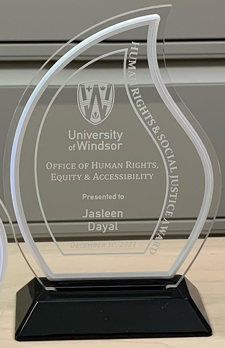 clear acrylic trophy presented to Jasleen Dayal, Human Rights and Social Justice Award