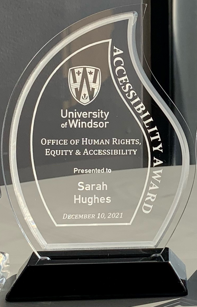 clear acrylic trophy presented to Sarah Hughes, Accessibility Award