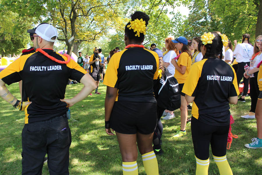 Faculty leaders standing outside at the river games during welcome week