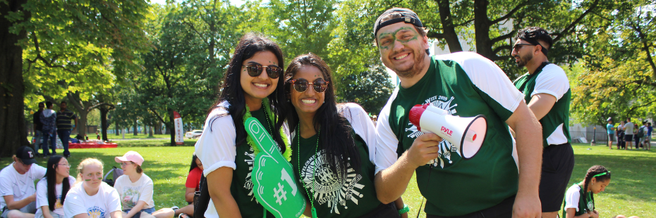 Three faculty of science students standing outside of the Welcome Week Fair