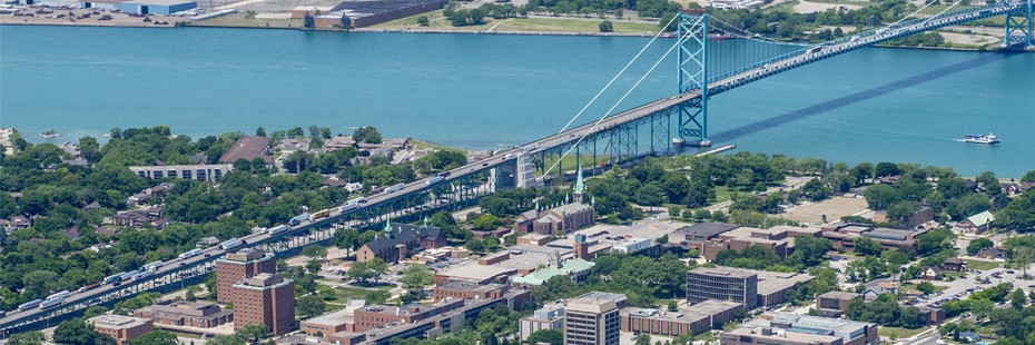 Aerial shot of the UWindsor Campus and the Ambassador Bridge