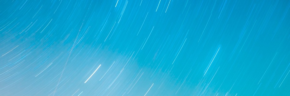 A non-representative header featuring an altered shot of a blue sky in the darkening night. Several of what are likely comets or other streaks of light are visible.