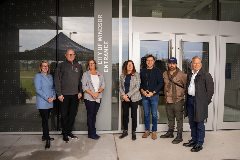 University of Windsor and City of Windsor personnel pose in front of the new City of Windsor Entrance at the Toldo Lancer Centre.