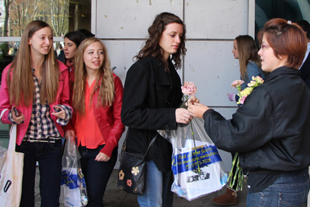 handing out carnations