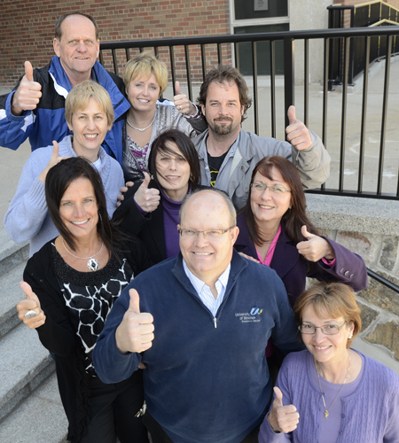 colleagues signalling a thumbs-up