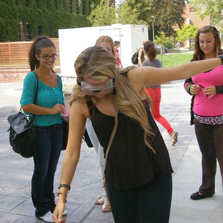 woman wearing goggles weaves along line