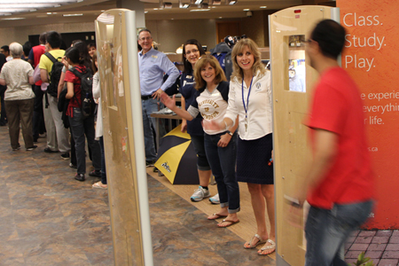 staff greeting patrons entering Campus Bookstore