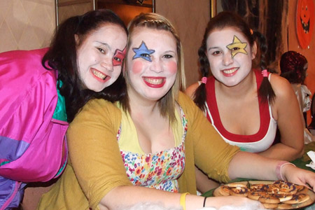 Students with colourful stars painted over their eyes.