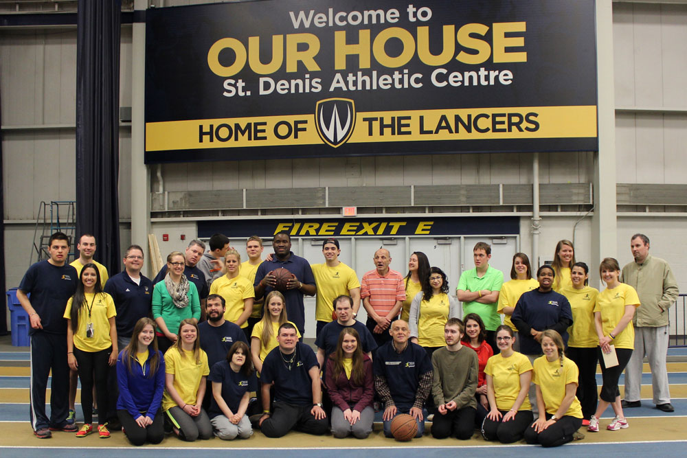 Participants in the Adapted Physical Exercise (APEX) program coordinated by PhD student Kelly Carr pose at the St. Denis Centre in this 2014 handout photo.