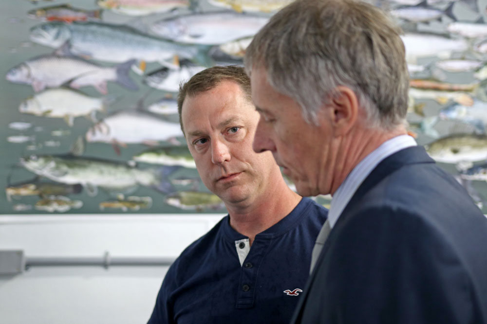 Dr. Trevor Pitcher talks to University of Windsor President Dr. Alan Wildeman at the grand opening of the Freshwater Restoration Ecology Centre in LaSalle, Ont.