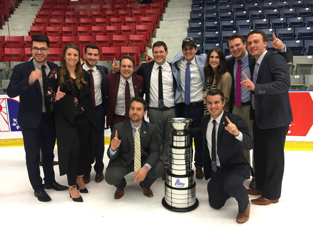 University of Windsor master of business administration students pose with the Quebec Major Junior Hockey League's President's Cup.