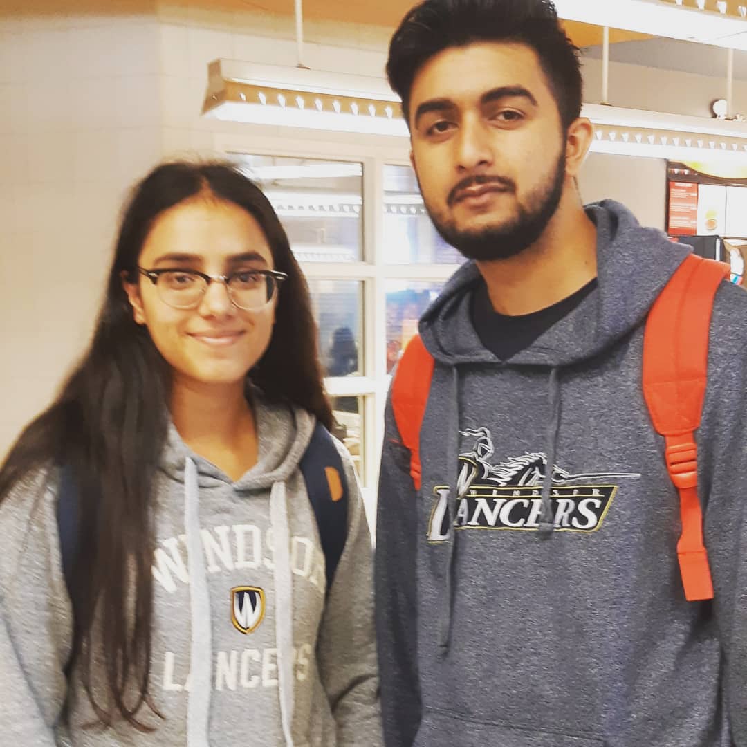 two students wearing Windsor sweatshirts