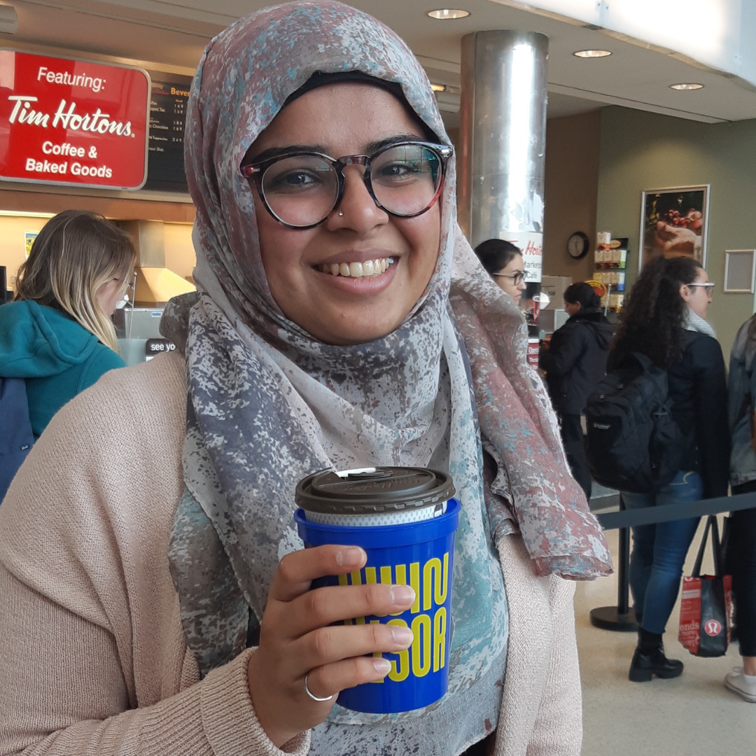 Student holding spirit cups