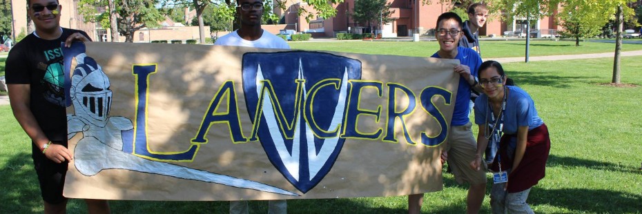 Students holding a banner that says 'Lancers'
