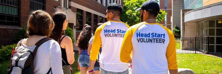 Head start volunteers talking with new students