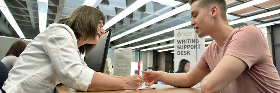 Student getting help at the writing support desk