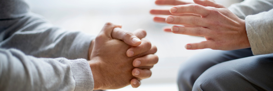 Two people in counselling