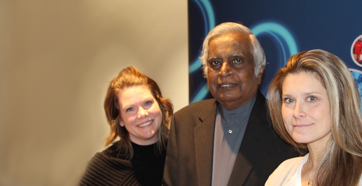 Co-chairs Sheri Lowrie and Datta Pillay of the United Way campus campaign congratulate Anita Bondy, winner of an extra vacation day in the charity’s appreciation draw.