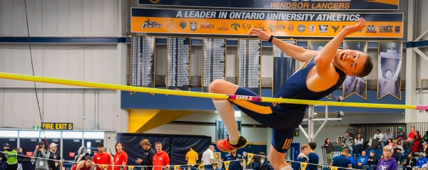 A male athlete competes in a high jump competition