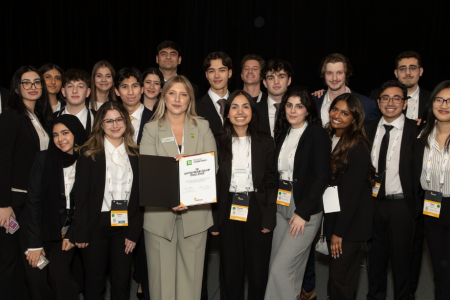 Enactus Windsor holds one of their awards