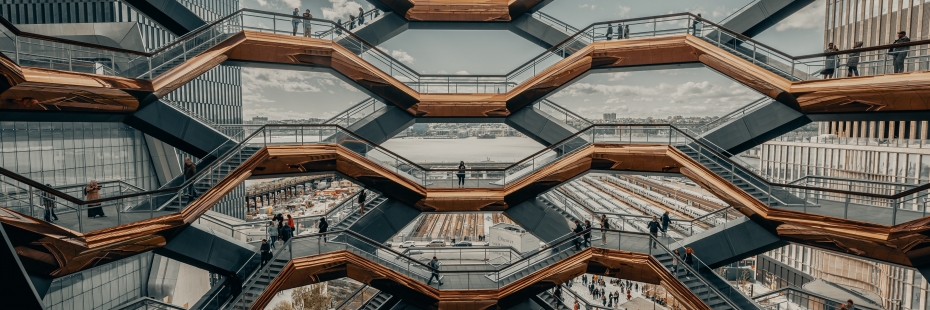 Layers of staircases and platforms arranged in honeycomb patterns.