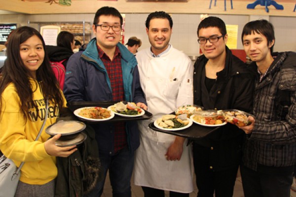 diners in cafeteria holding Chinese food