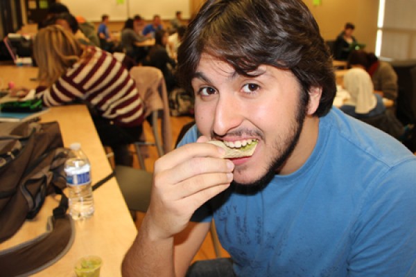 Physics major Anthony Piazza indulges in a little Mole Day snack.