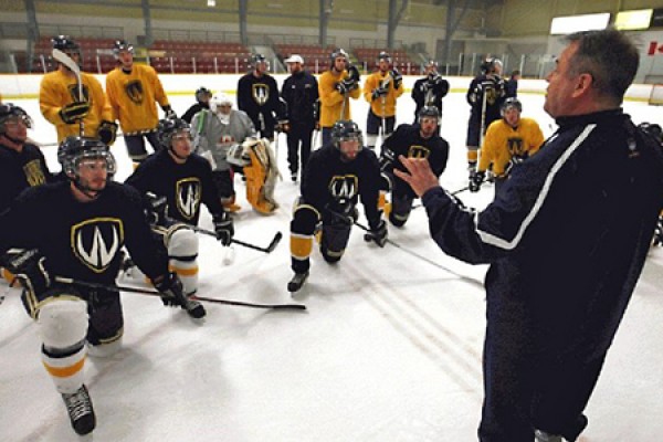 Lancer players listen to coach.