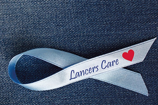 ribbon reading &quot;Lancers Care&quot;