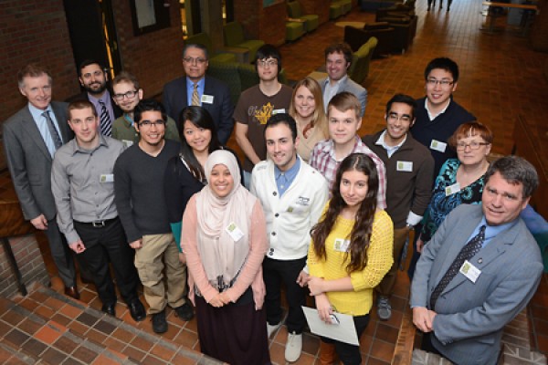 Administrators and faculty congratulate graduating Outstanding Scholars.