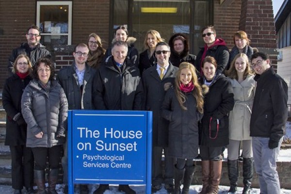 Students, faculty and staff of the House on Sunset turn out to welcome UWindsor president Alan Wildeman.