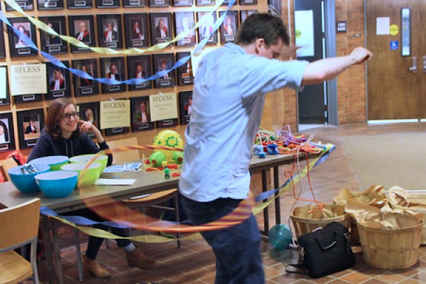 Elisa Durante looks on as Sheldon Reiche twirls a hula hoop