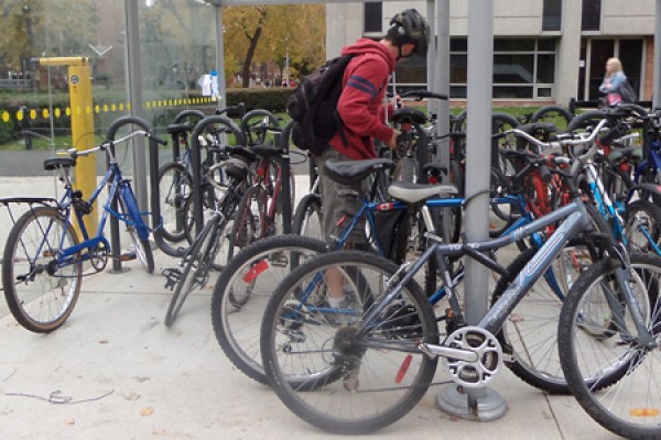 Hayden Burnett locks his bike in the shelter outside Essex Hall.