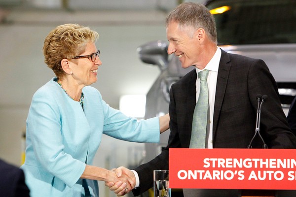 Premier Kathleen Wynne shakes hands with UWindsor president Alan Wildeman.