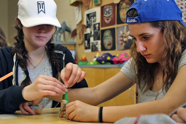 Alexis Pelletier and Kierra Marentette, Grade 8 students at Lakeshore Discovery School, work on their secret project during the Let’s Talk Science Challenge, Friday in the Education Building. 