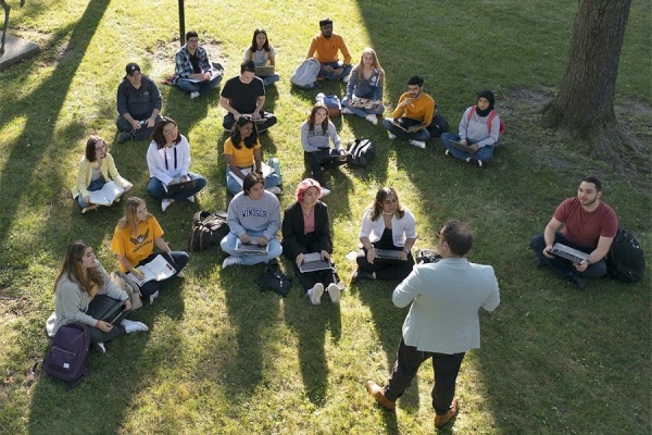 students sit in a circle