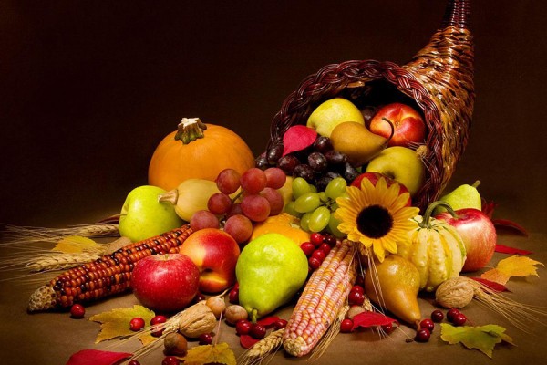 woven cornucopia spilling over with produce