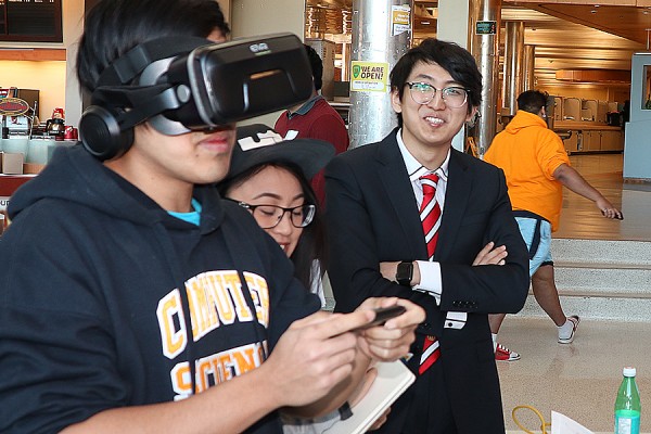 Students try out virtual reality during Computer Science Demo Day, Monday in the student centre.