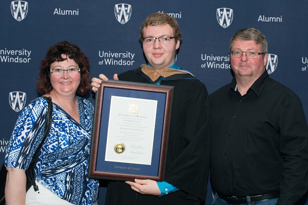 Ryan Lawson (centre) and his parents