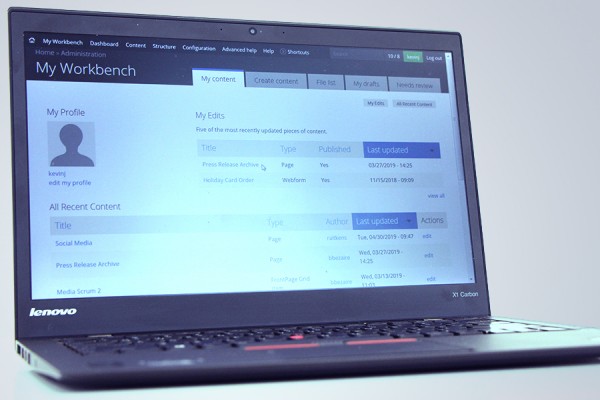 laptop displaying Drupal screens