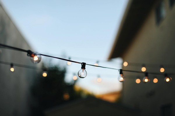lights strung across outdoor party space