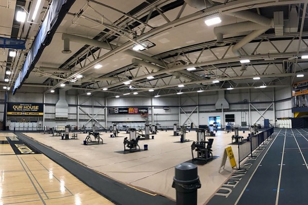 Exercise equipment in St. Denis fieldhouse.