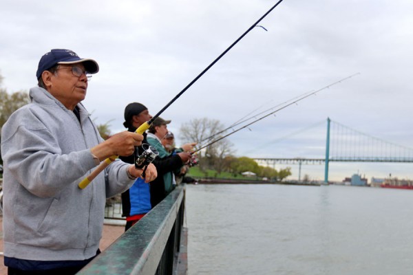 fishers on Detroit River shore