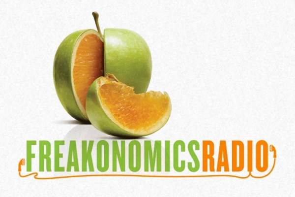 Freakonomics logo: a green apple sliced to reveal inside is an orange.