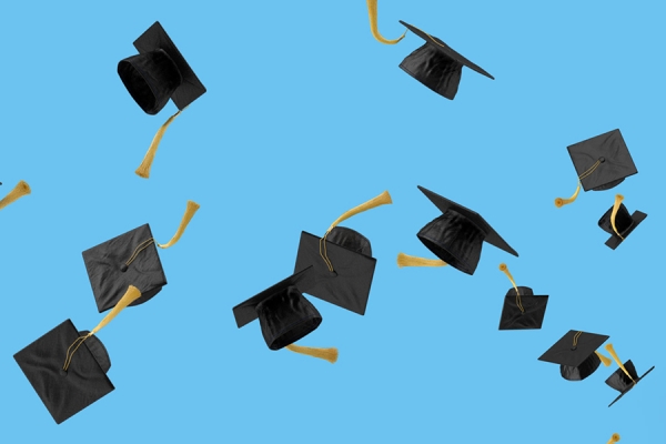 tasselled mortarboards tossed in the air