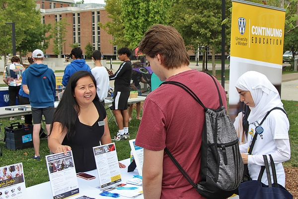 Siu Le staffs a booth promoting Continuing Education programs to students.