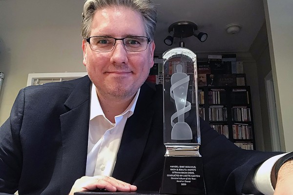 John Holland poses with his Juno statuette