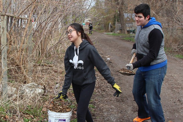 KimBui and RifaatSaid volunteers come out to ready the plot for spring planting.