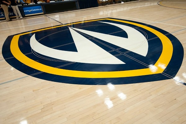 Lancer logo on floor of Dennis Fairall Fieldhouse