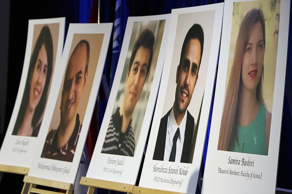 Placards displaying photos of deceased